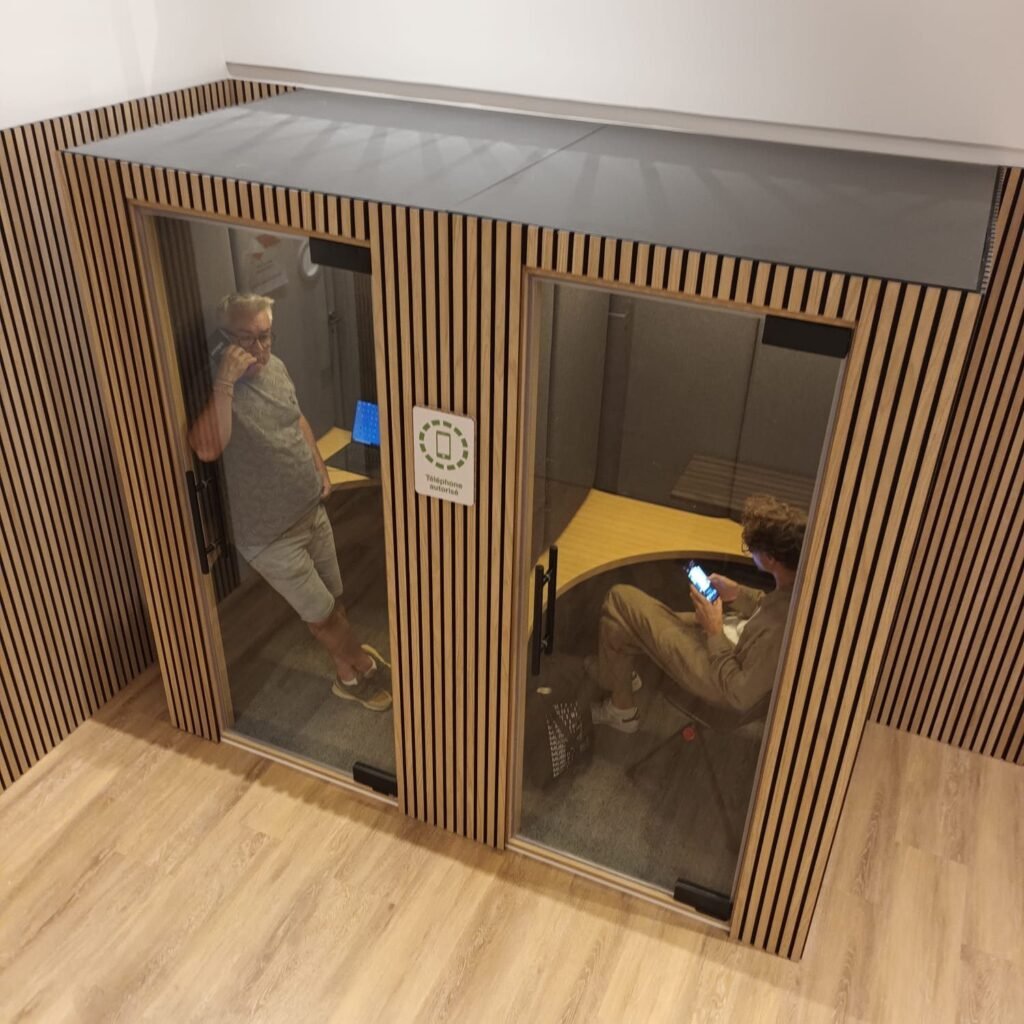 Pair of timber-clad acoustic booths in use at the BPI Lumière