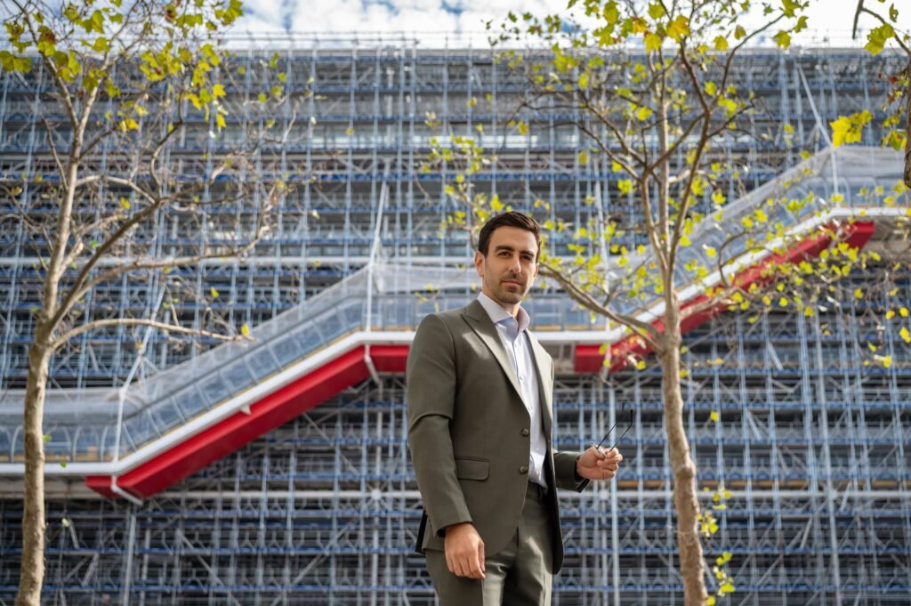 Andrés Mariño Maza in front of the Centre Pompidou at Beaubourg, Paris, with the building under scaffolding for its renovation